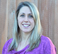 a headshot of Dr. Adrienne Goodman-LaMora smiling